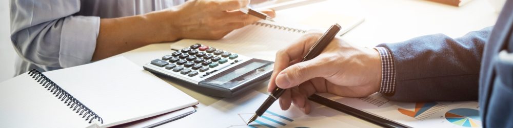 business man financial inspector and secretary making report, calculating or checking balance. Internal Revenue Service inspector checking document. Audit concept