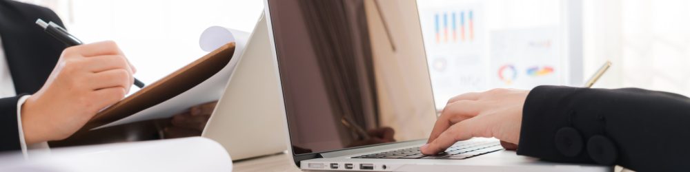 Business people using laptop  and Financial charts  at meeting office