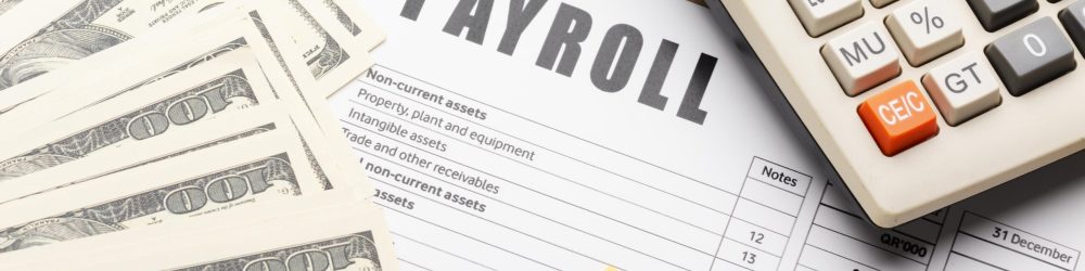 payroll-still-life-with-cash-high-angle